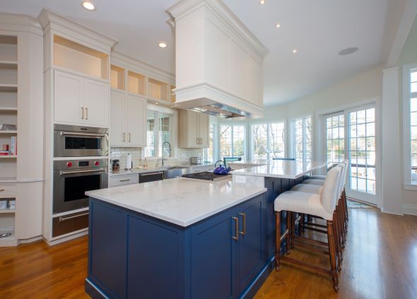 A beautiful royal blue Woodharbor island makes this 314 Design Studio kitchen sing!