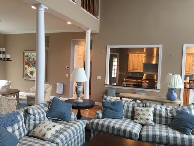 BEFORE PHOTO: Showing wall that was chosen for removal to open up the floor plan to move the dining area to the main living space