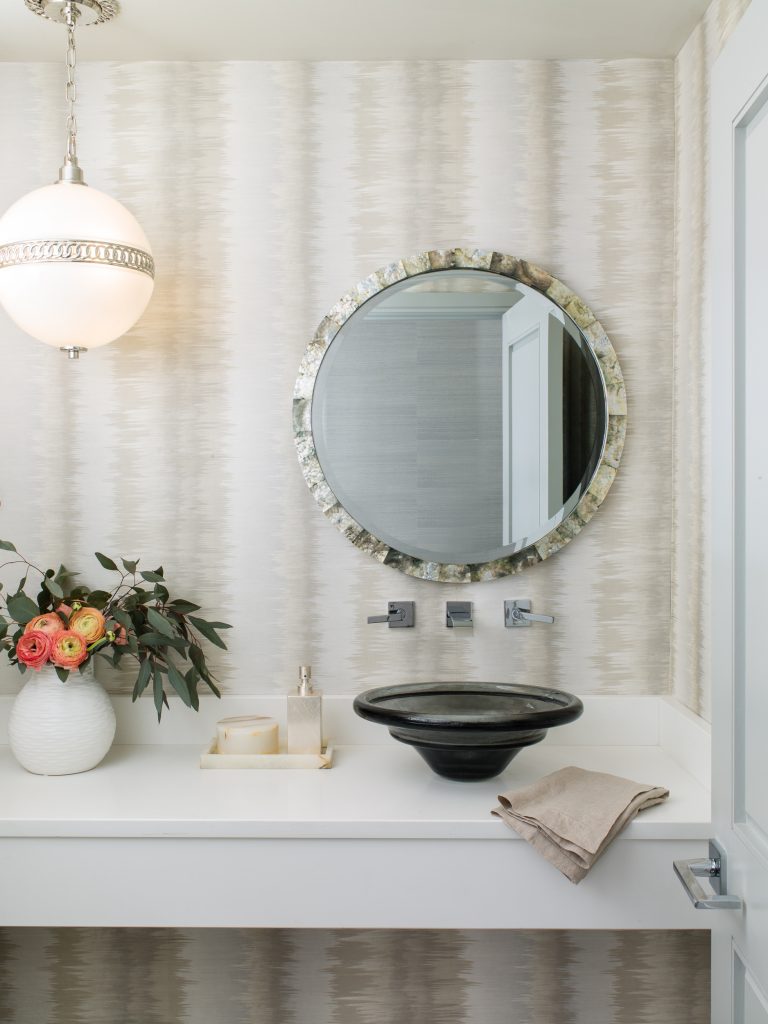 Powder Room built by Lundberg Builders. Interior Design by Laura Hodges Studio features a black smoky glass sink. 